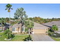 Single-Gathering home with two-car garage and landscaped yard at 10520 Collar Dr, San Antonio, FL 33576