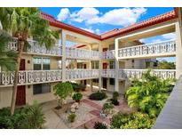 Inviting courtyard with lush landscaping, creating a serene atmosphere at 1012 Pearce Dr # 209, Clearwater, FL 33764