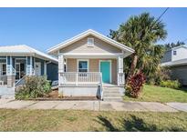 Quaint bungalow-style home with teal door and front porch at 1325 W North B St, Tampa, FL 33606