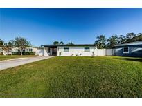 Newly renovated home with a landscaped yard and modern curb appeal at 6315 35Th N Ave, St Petersburg, FL 33710