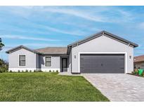 Charming single-story home features a gray facade, well-manicured lawn, and a gray brick driveway at 5321 Crestline Ter, Port Charlotte, FL 33981