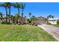 Single-Gathering home with attractive landscaping at 9907 San Sierra Way, Port Richey, FL 34668