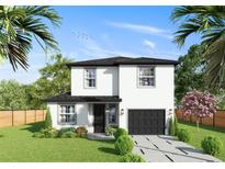 Two story home with modern exterior and attached garage at 12905 Worchester Ave, Tampa, FL 33624