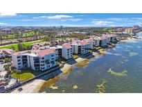 Condo building along waterfront with beach and boat slips at 5825 Puerta Del Sol S Blvd # 170, St Petersburg, FL 33715