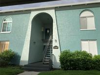 Building exterior with a charming entrance and staircase at 11404 3Rd N St # 1, St Petersburg, FL 33716