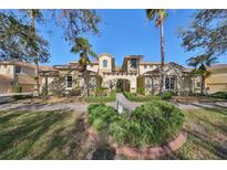 Townhouse with landscaping and walkway at 1357 Emerald Dunes Dr, Sun City Center, FL 33573