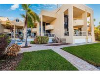 Luxury waterfront home with private pool and lush landscaping at 722 Pinellas Bayway S # 102, St Petersburg, FL 33715