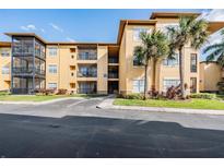 Apartment building with ample parking and lush landscaping at 4323 Bayside Village Dr # 105, Tampa, FL 33615