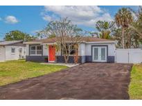 Modern home with gray and white exterior at 1702 Bayou Grande Ne Blvd, St Petersburg, FL 33703