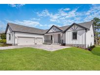 Stunning two-story home with three-car garage and landscaped yard at 4047 Southern Valley Loop, Brooksville, FL 34601