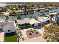 Aerial view of waterfront home with dock and spacious backyard at 2599 W Bay Isle Se Dr, St Petersburg, FL 33705