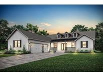 Stunning farmhouse-style home with a 3-car garage at 5880 Creek Ridge Rd, Brooksville, FL 34601