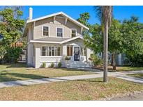 Charming two-story home with a white brick facade and landscaping at 1045 17Th N Ave, St Petersburg, FL 33704