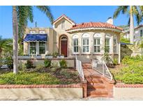 Charming bungalow with terracotta roof and brick pathway at 1718 1St N St, St Petersburg, FL 33704