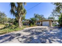 Ranch style home with attached garage at 300 Pinellas S Way, St Petersburg, FL 33707