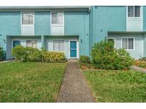 Teal condo building with walkway at 131 114Th Ne Ter # 131, St Petersburg, FL 33716