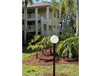 Exterior view of a condo building at 2690 Coral Landings Blvd # 535, Palm Harbor, FL 34684