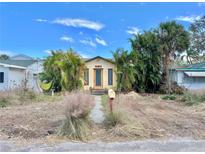 Charming bungalow-style home with a landscaped yard at 3020 Clinton S St, Gulfport, FL 33707