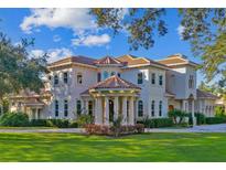 Stunning two-story home with a tile roof and manicured lawn at 602 Guisando De Avila, Tampa, FL 33613