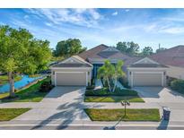 Two-story home with two-car garage and landscaped yard at 27133 Ipswich Dr, Englewood, FL 34223