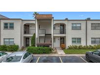 Two-story building with four units and well-maintained landscaping at 7701 Starkey Rd # 324, Seminole, FL 33777