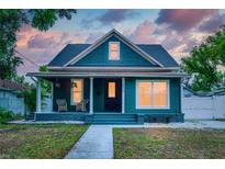 Charming home with a covered front porch, perfect for relaxing outdoors at 3506 N Arlington Ave, Tampa, FL 33603