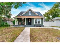 Charming craftsman home with a welcoming front porch and well-maintained lawn at 3506 N Arlington Ave, Tampa, FL 33603