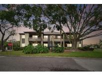 Two-story building with lush landscaping and parking at 10263 Gandy Blvd N Blvd # 2005, St Petersburg, FL 33702