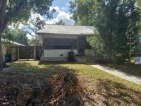 Quaint house exterior with a screened porch at 5748 Montana Ave, New Port Richey, FL 34652
