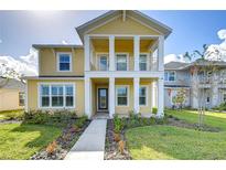 Two-story craftsman style home with a front porch and walkway at 3731 Tea Leaf Aly, Land O Lakes, FL 34638