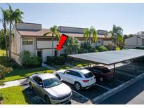 Condo complex with carport parking and tennis courts nearby at 9209 Seminole Blvd # 75, Seminole, FL 33772