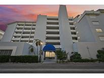 Condo building exterior at sunset, featuring a grand entrance at 1050 Riverside Dr # A201, Palmetto, FL 34221