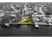 Property overview showing house, pool, and waterfront location at 306 Blanca Ln, Tampa, FL 33606