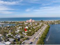 Stunning aerial view of property near the ocean and local attractions at 3302 E Maritana Dr, St Pete Beach, FL 33706