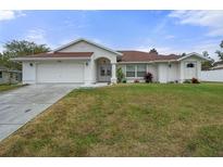 One-story house with attached garage, and a well-maintained lawn at 5356 Kirkwood Ave, Spring Hill, FL 34608