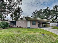Mid-century modern home with carport at 315 Lime Tree Rd, Tampa, FL 33619