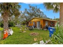 House exterior with a small grassy backyard at 225 35Th N St, St Petersburg, FL 33713