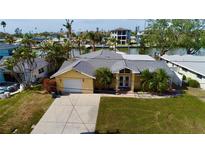 Single Gathering home with attached garage and waterfront access at 15918 Redington Dr, Redington Beach, FL 33708