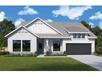 Craftsman style home with gray siding and black garage door at 18136 Foxtail Loop, Venice, FL 34293