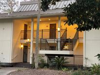 Two-story building with exterior lighting at 29254 Bay Hollow Dr # 3262, Wesley Chapel, FL 33543
