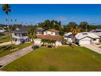 Aerial view of a residential neighborhood showcasing homes with lush landscaping at 3406 Bayshore Ne Blvd, St Petersburg, FL 33703