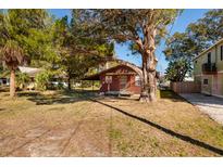 Charming single-story home featuring a cozy front porch and a spacious front yard with mature trees at 7176 Westwind St, Weeki Wachee, FL 34607