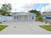 Newly built home with front yard and driveway at 1117 Beverly Ave, Largo, FL 33770