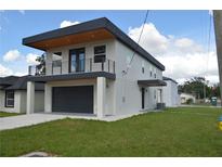 Modern two-story home with attached garage and balcony at 3915 W Robson St, Tampa, FL 33614