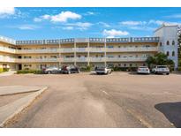 Two-story condominium building with ample parking and attractive facade at 2221 Swedish Dr # 55, Clearwater, FL 33763