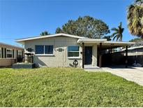 Charming Ranch style home with a well-manicured lawn at 5018 Chancellor Ne St, St Petersburg, FL 33703