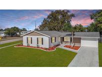 Aerial view of a charming house with a landscaped yard at 6269 Skyline Ct, Spring Hill, FL 34606