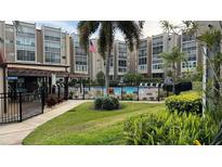 Community pool with surrounding patio furniture at 1243 S Martin Luther King Jr Ave # B205, Clearwater, FL 33756