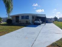 Mobile home with carport at 164 Colonial Ct # 19, Palm Harbor, FL 34684