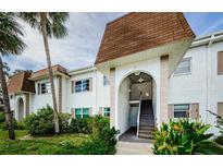 Exterior view of building, showing stairs and landscaping at 211 S Mcmullen Booth Rd # 189, Clearwater, FL 33759
